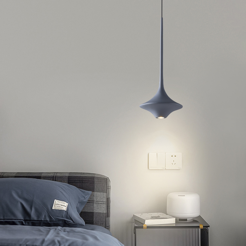 Sleek LED pendant light in a modern dining room setting, highlighting its elegant design and soft illumination.