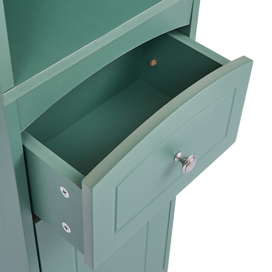Freestanding tall green storage cabinet positioned in a cozy corner, demonstrating its space-saving capabilities.