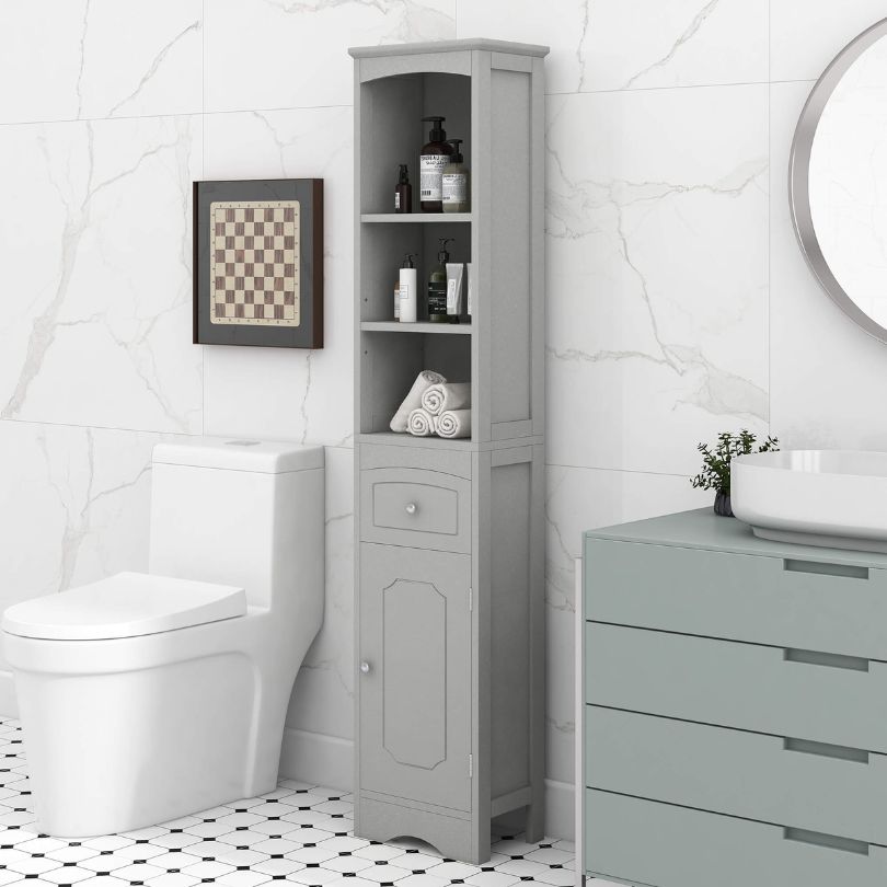 Elegant tall grey freestanding storage cabinet showcasing adjustable shelves and drawer from a side angle.
