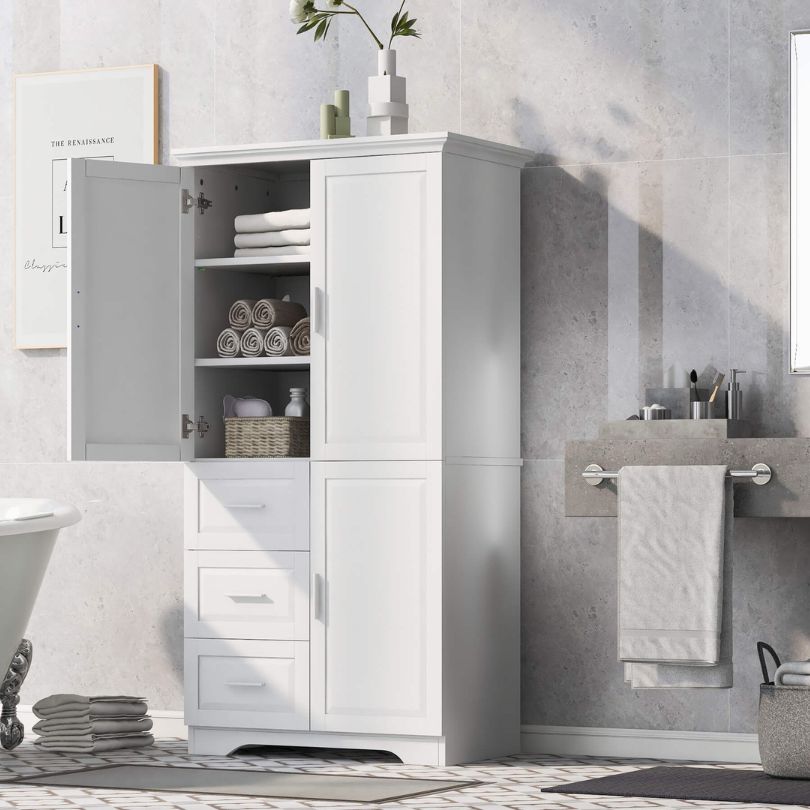 Interior view of tall white cabinet with adjustable shelves, ideal for organizing various items.