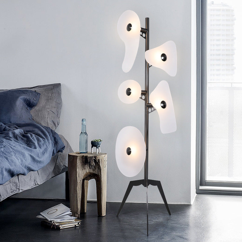 Elegant Orbital Art Deco Floor Lamp showcasing colorful glass reflectors in a modern living room setting.
