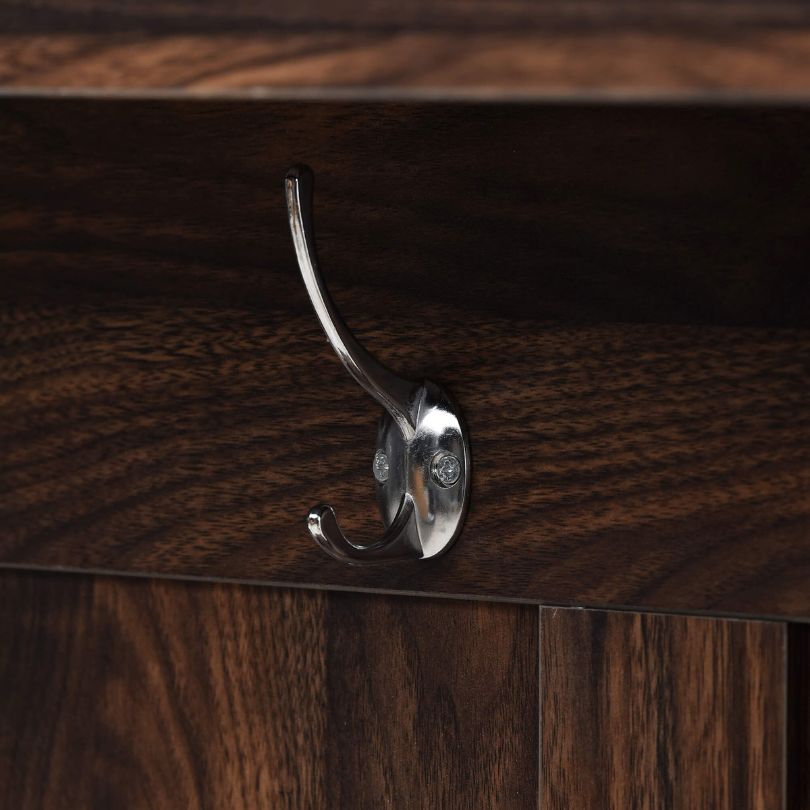 Side view of the hall tree showcasing its hooks and storage bench.