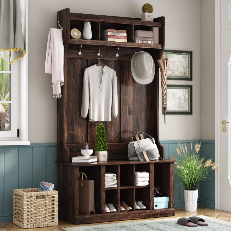Side view of the hall tree showcasing its hooks and storage bench.