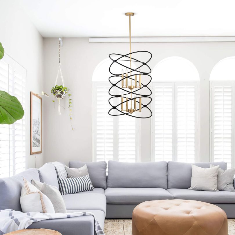 Detail shot of candle-like bulb holders on both tiers, illustrating the chandelier’s transitional style.