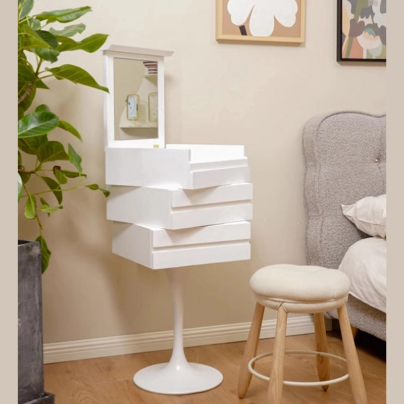 Elegant tulip-shaped compact vanity showcasing flip-top mirror and drawers in a stylish bedroom setting.