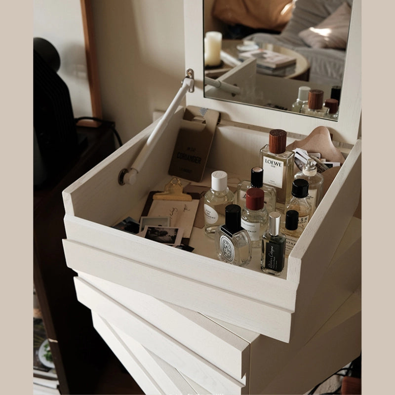 Close-up view of the hidden storage compartment and velvet-lined drawers of the chic vanity.