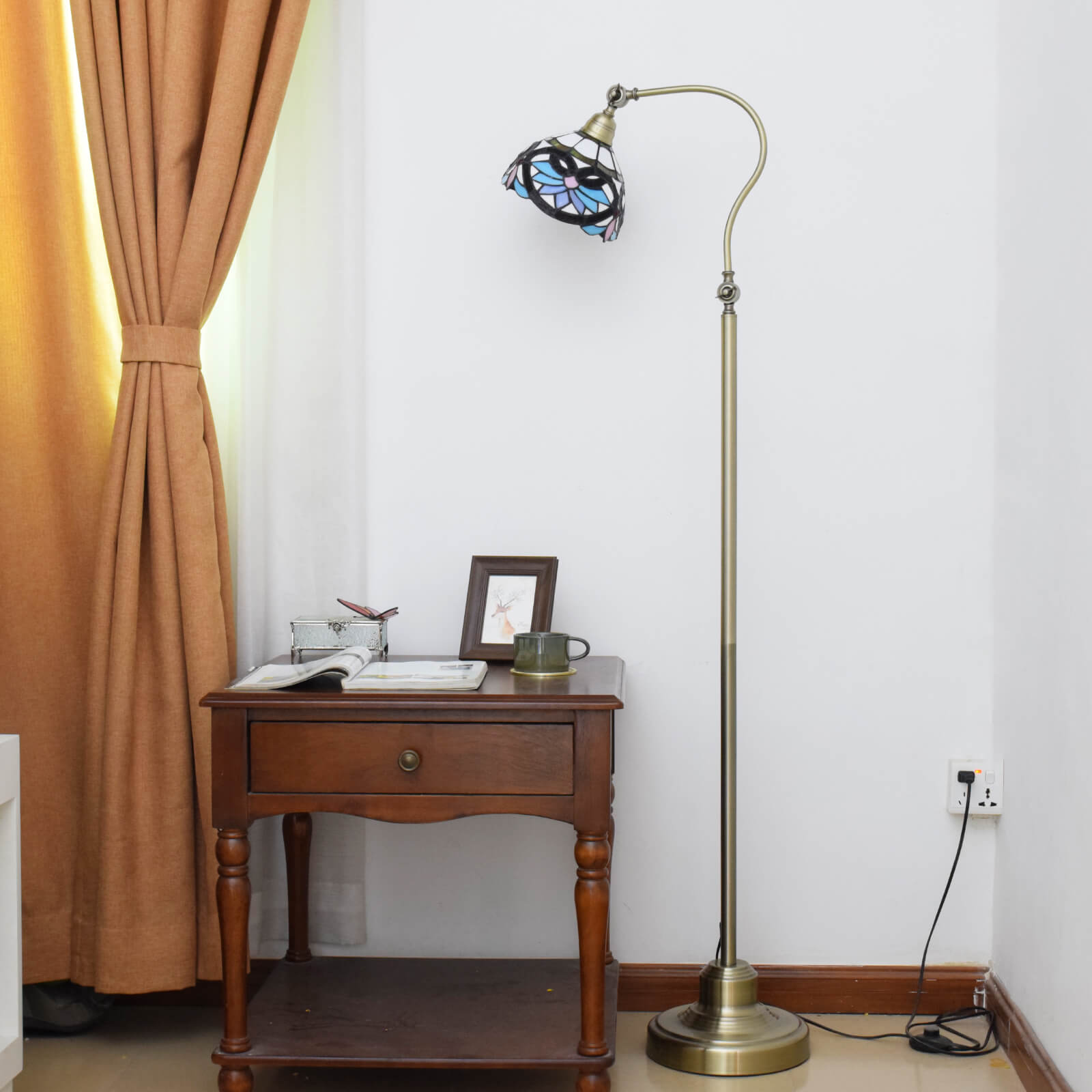 Stylish modern Tiffany floor lamp enhancing the decor of a contemporary living room.