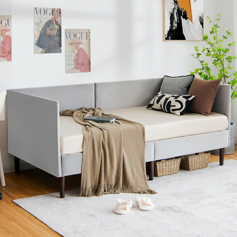 Stylish twin daybed wooden sofa bed frame in a cozy living room setting.
