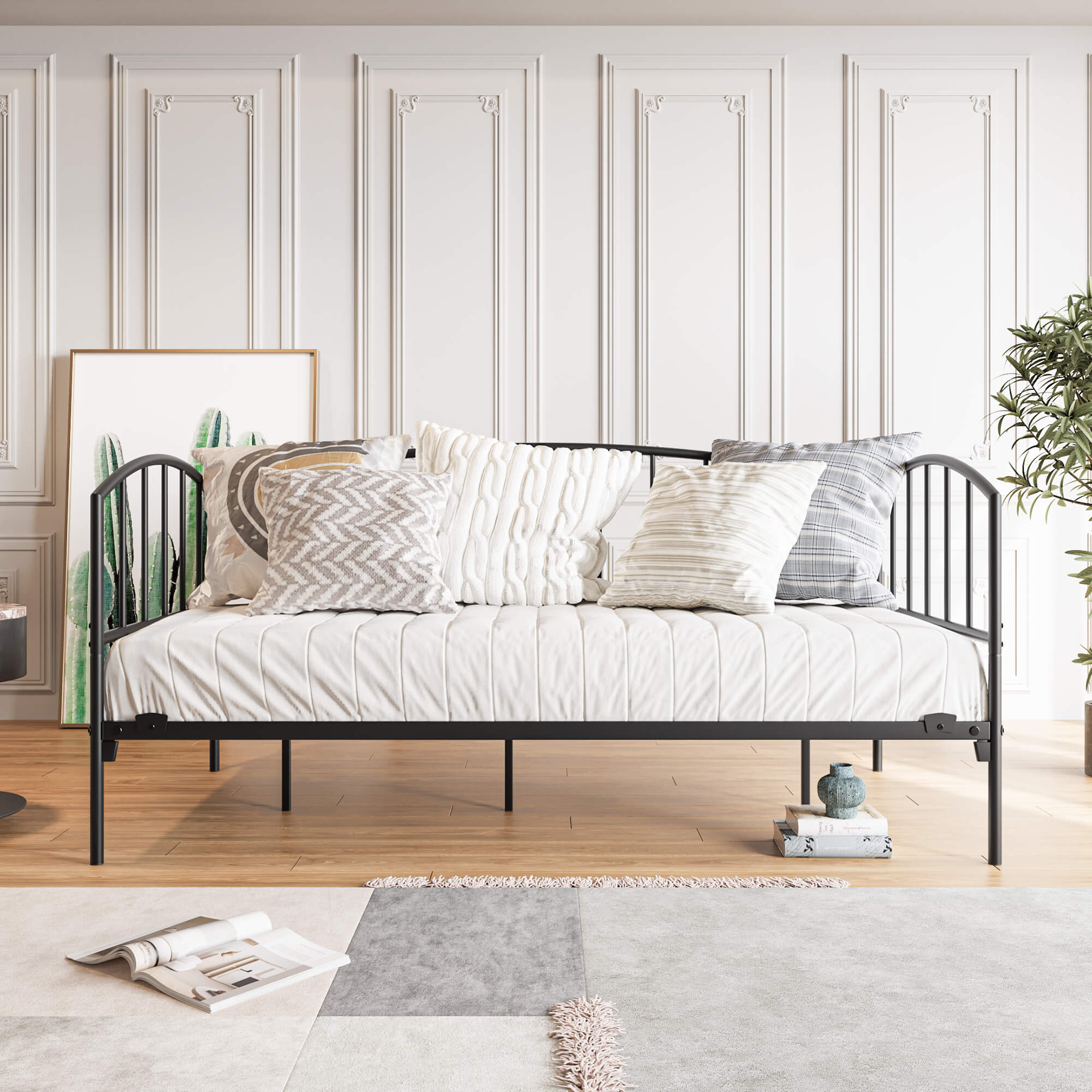 Black twin size metal daybed frame with headboard in modern living room setup.