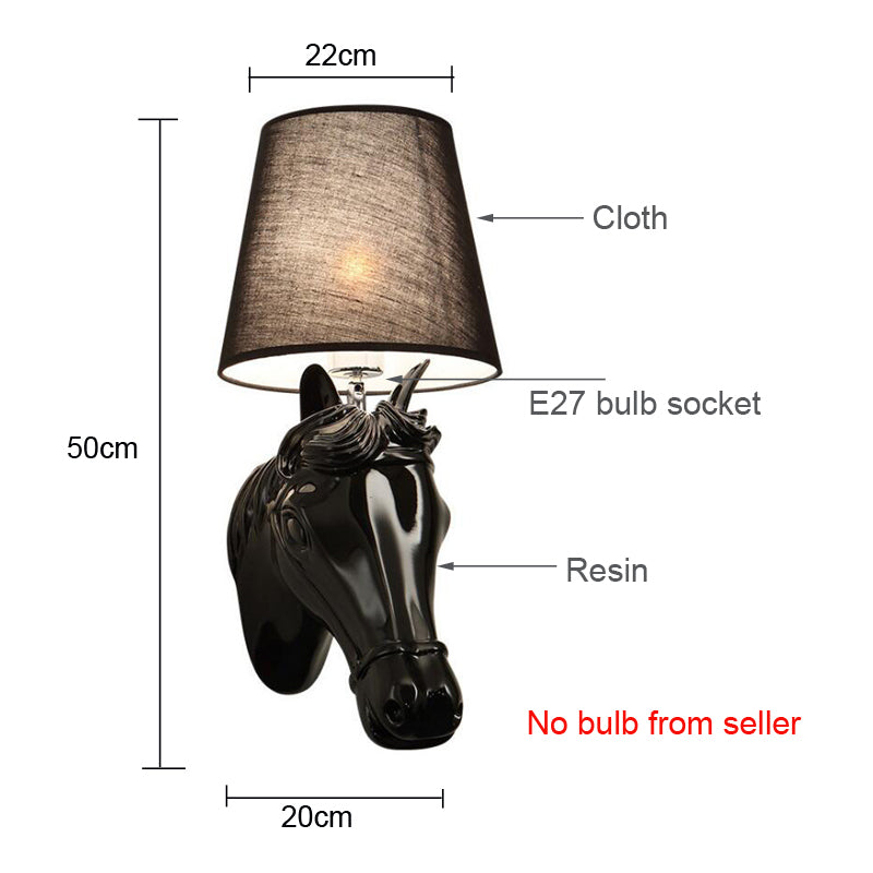 Wall-mounted lamp casting warm light in a modern bedroom interior