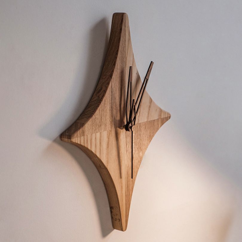 Close-up of the clock face and star design, perfect for adding charm to any room.