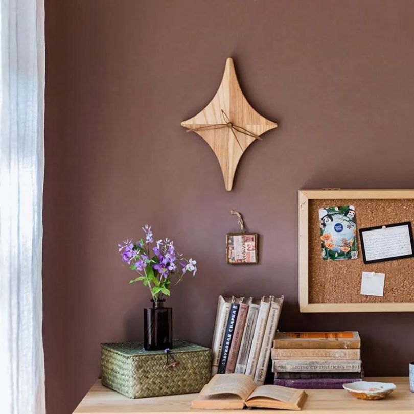 Front view of the rustic star wooden wall clock showcasing its unique design.