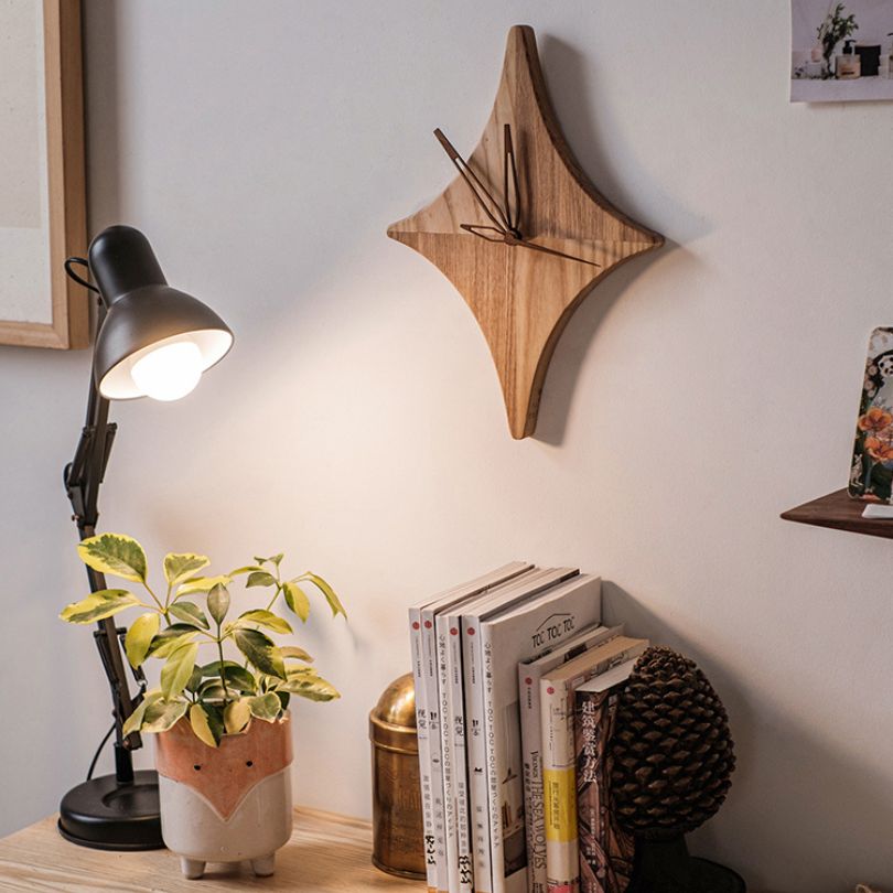 Front view of the rustic star wooden wall clock showcasing its unique design.