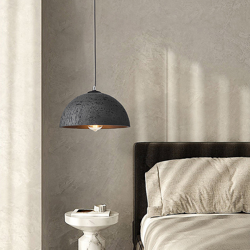 Modern pendant lamp illuminating a cozy dining area in a restaurant.