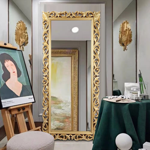 Full body reflection in the elegant Victorian vanity mirror, emphasizing its size and luxurious design.