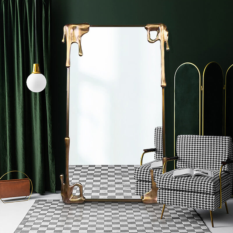 Elegant vintage bronze frame mirror showcasing its full-length design in a bright bedroom setting.