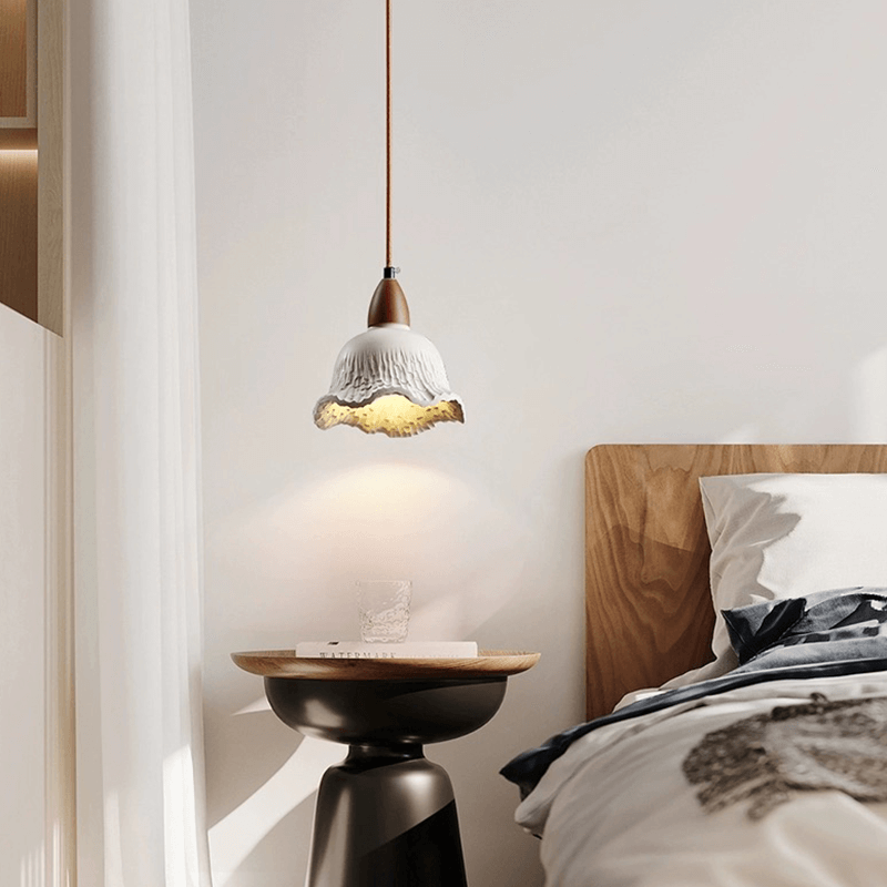 Vintage concrete hanging lamp showcasing its elegant flower shade design from a side angle.