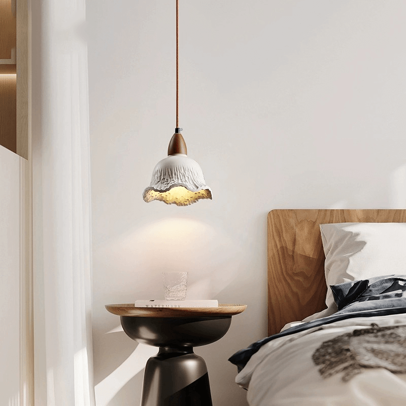 Adjustable hanging lamp for cafes displayed above a rustic wooden table, highlighting its warm glow.