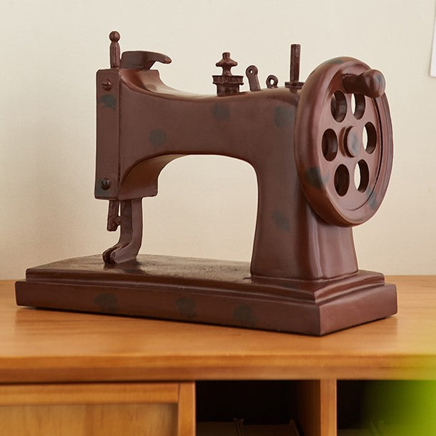 Vintage sewing machine decor placed in a beautifully styled sewing room.