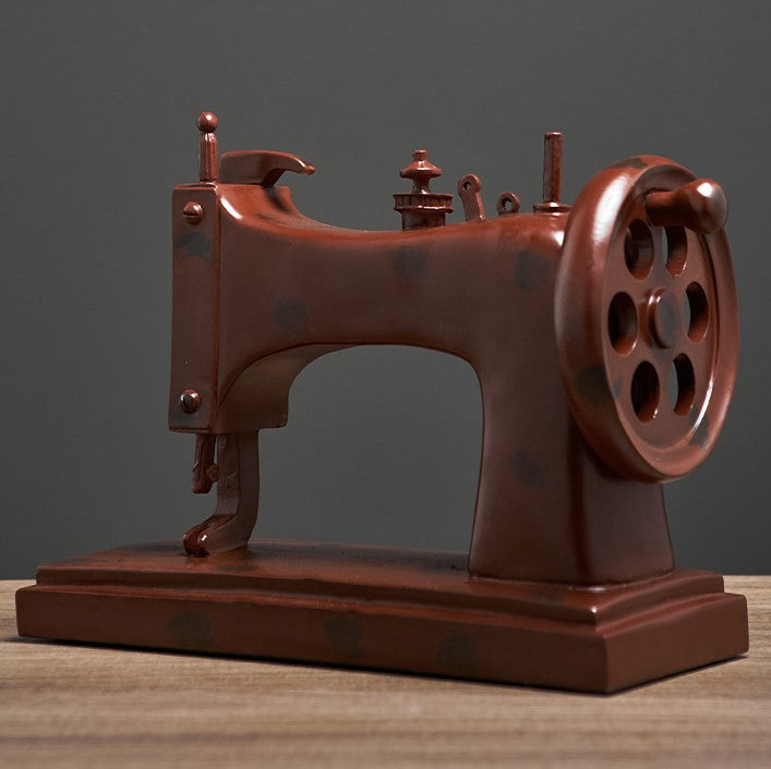 Close-up of resin sewing machine decor highlighting its craftsmanship.