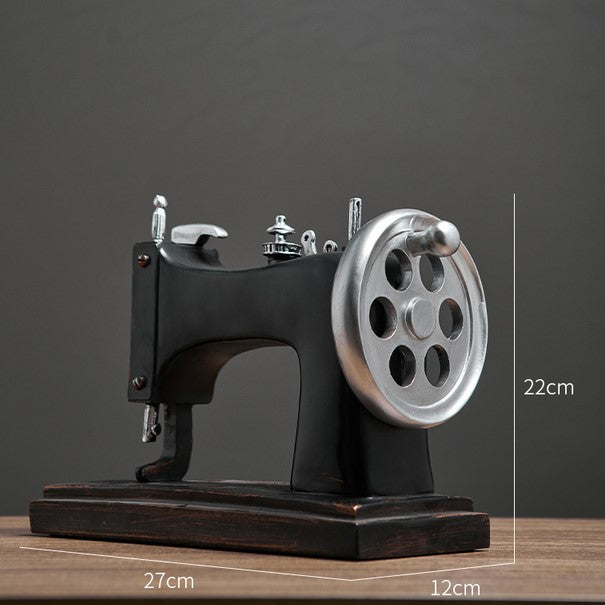 Close-up of resin sewing machine decor highlighting its craftsmanship.