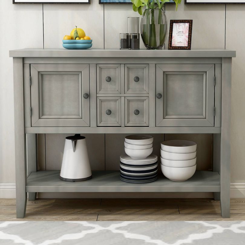 Antique gray vintage buffet table showcasing its elegant design and bottom shelf.