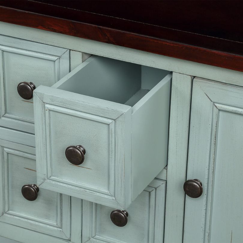 Close-up of the bottom shelf of the vintage solid wood entryway table, highlighting its storage capacity.