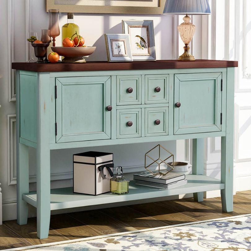 Close-up of the bottom shelf of the vintage solid wood entryway table, highlighting its storage capacity.
