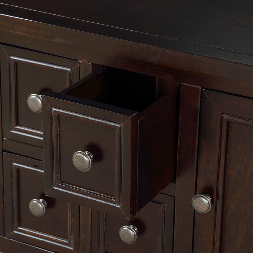 Elegant vintage buffet table showcasing intricate woodwork and dark brown finish.