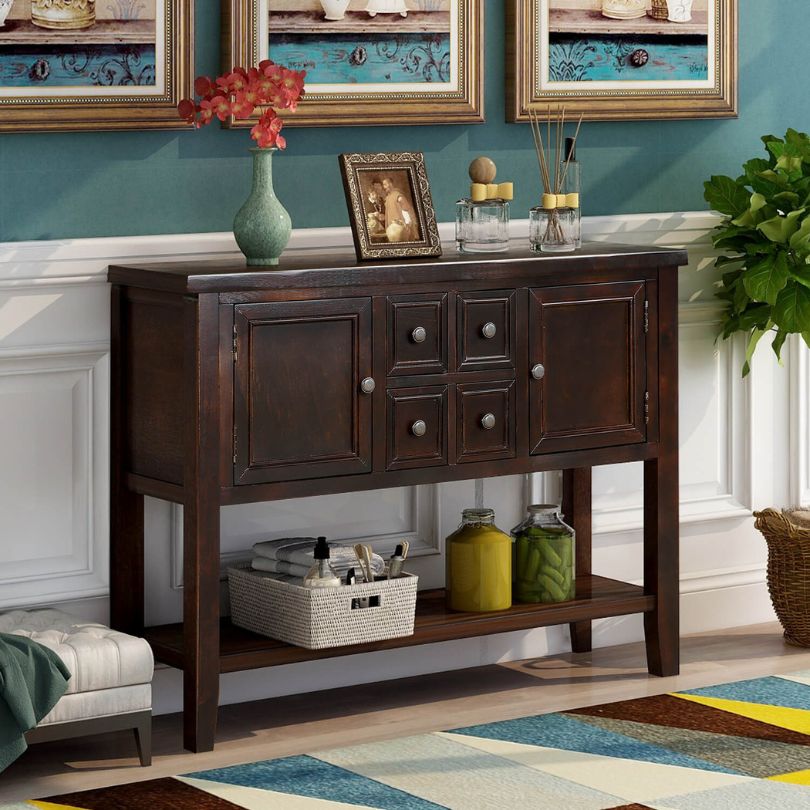 Entryway table with storage options, beautifully displaying decor and functional design.