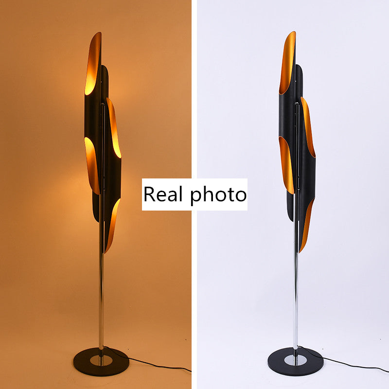 Elegant lamp placed beside a bed, demonstrating its use as a cheap bedside lamp for the living room.