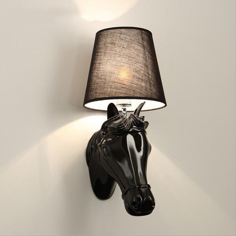 Close-up of LED wall light showing carved details of the resin horse design