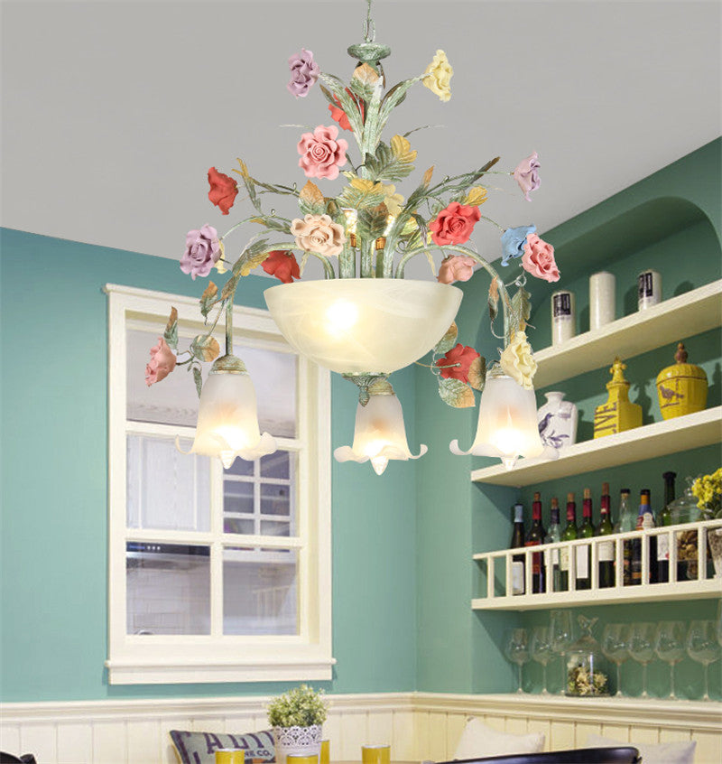 Close-up of the LED chandeliers frosted glass shade, illuminating a living room.