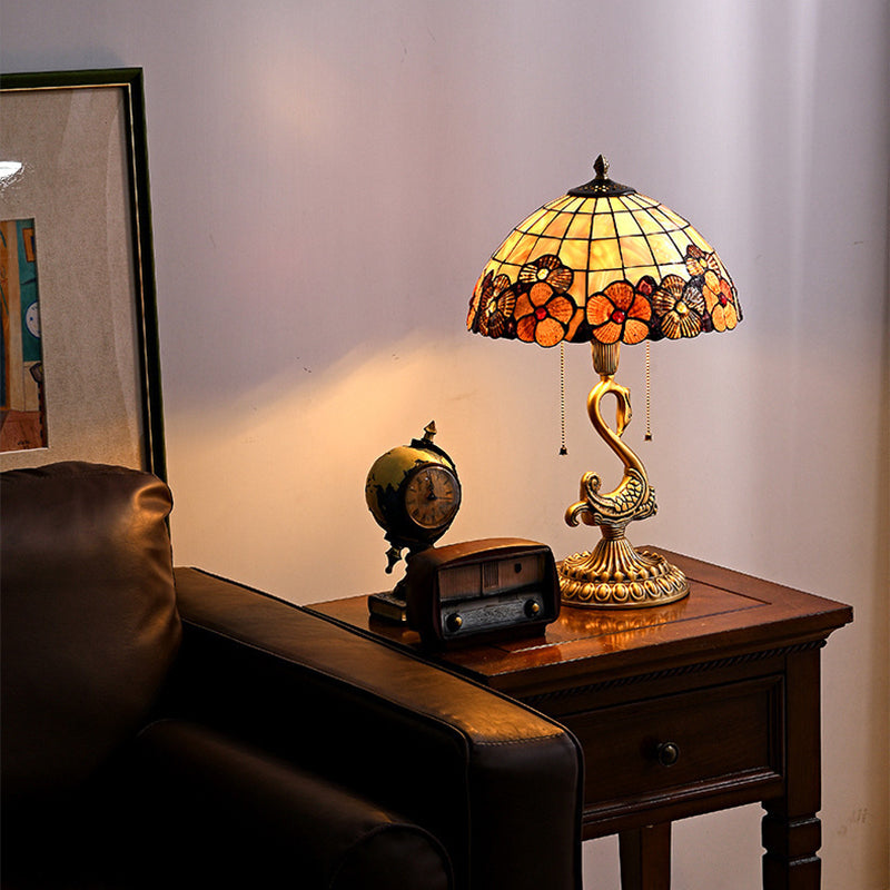 Elegant Swan Brass Table Lamp showcasing its unique design and copper base from a side angle.