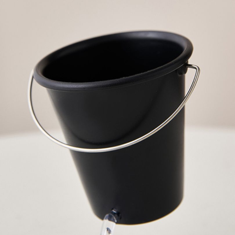 Black Water Bucket Design Pen Holder filled with colorful writing instruments, ideal for home office use.