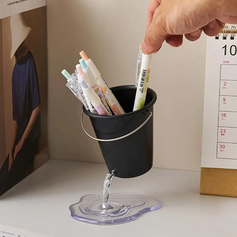 Chic Water Bucket Pen Holder displayed on a stylish desk, showcasing its modern design.