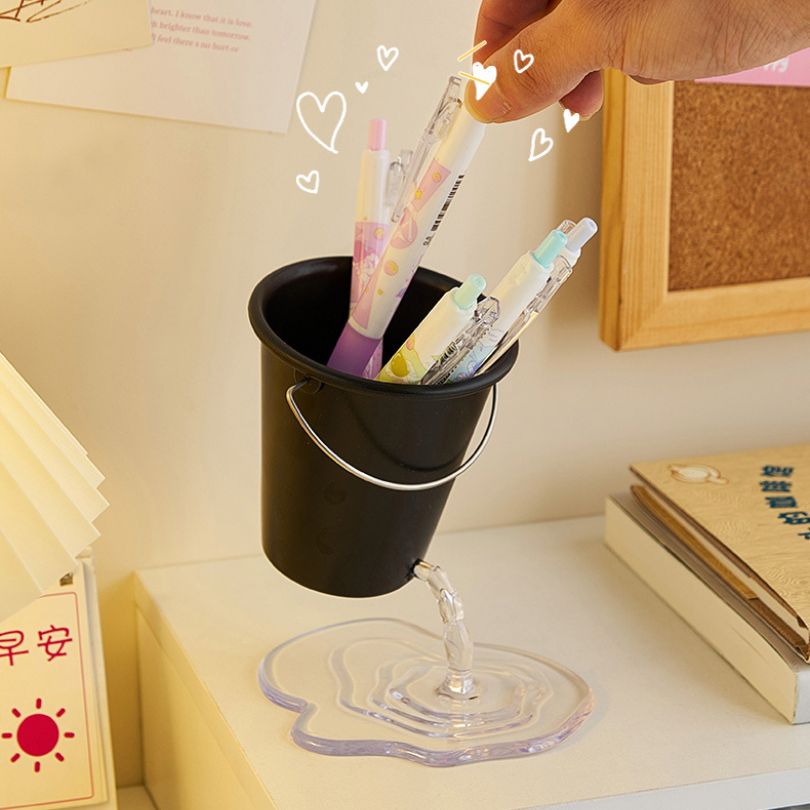 Stylish pen holder on a countertop, adding a decorative touch to an office space.