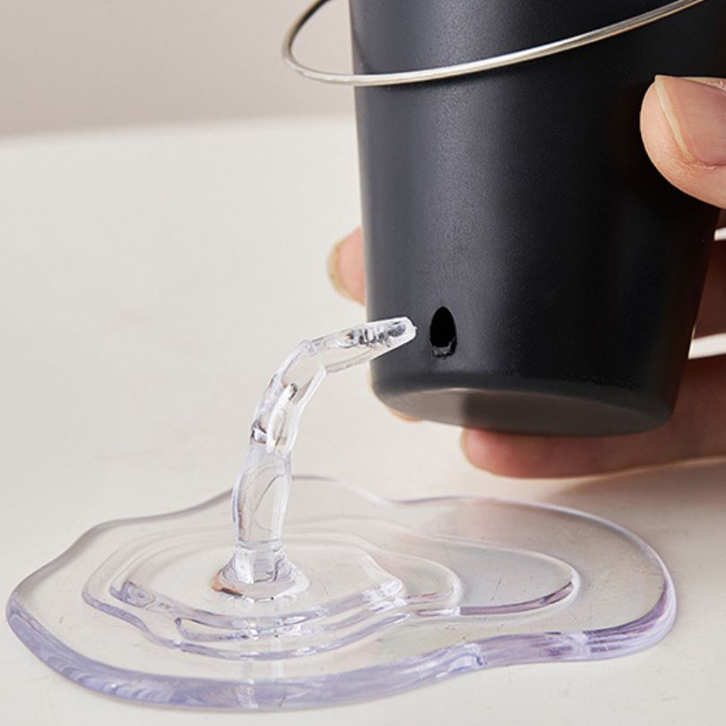 Chic Water Bucket Pen Holder displayed on a stylish desk, showcasing its modern design.