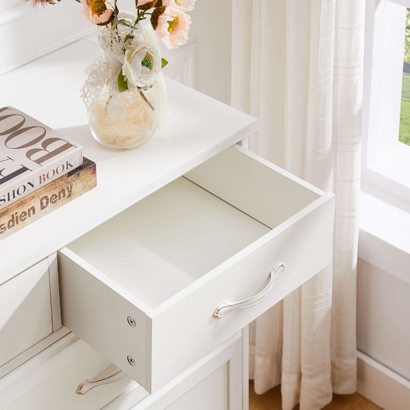 Close-up of vintage white handles on textured wood surface