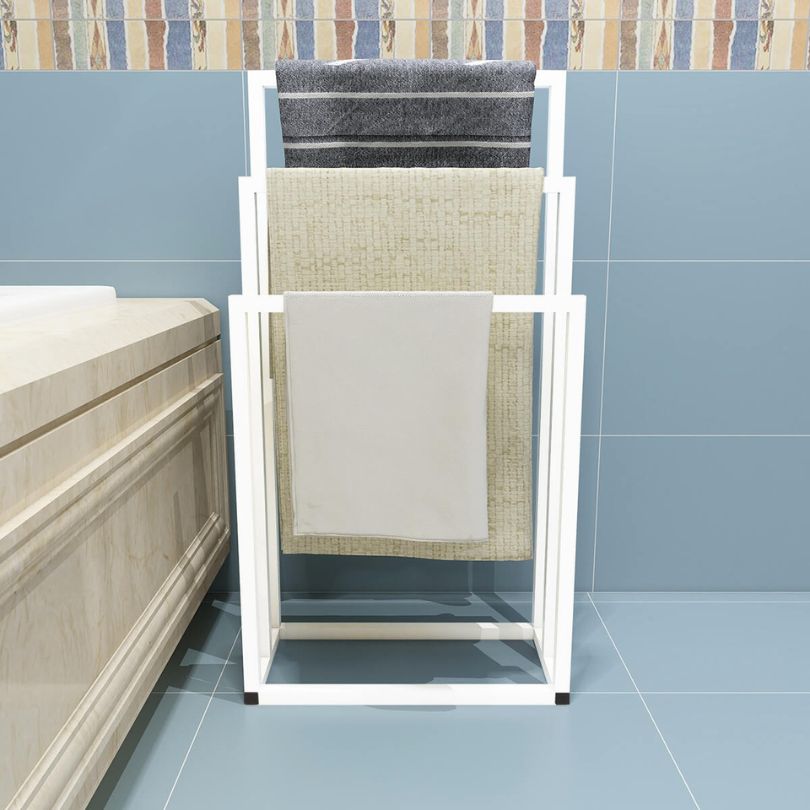 Close-up of the sleek chrome finish on the white metal towel holder.