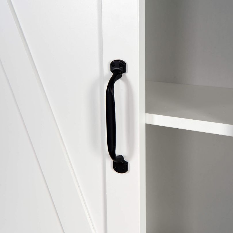 Over-the-toilet storage solution featuring a modern design with a sliding barn door.
