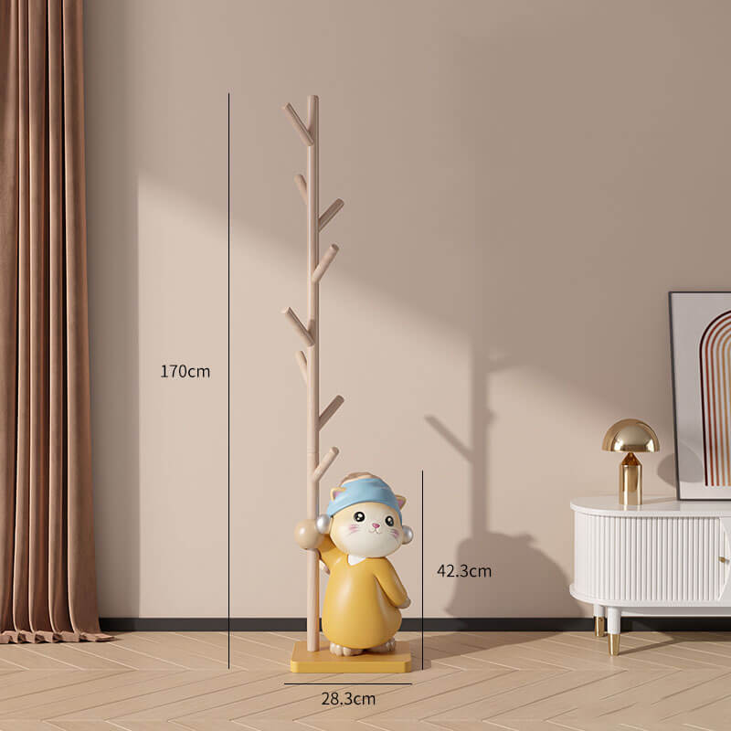 Side angle of the wood coat stand featuring a playful cat figurine base, highlighting its stability and design in a living room setting.