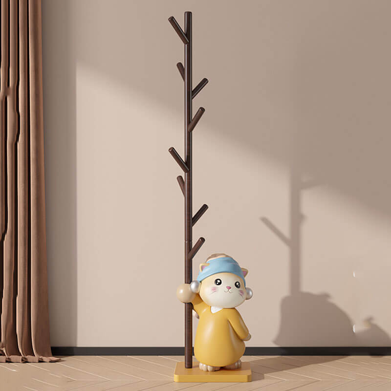 Front view of the Scandinavian Cat Figurine Wood Coat Rack in a bright entryway, displaying its natural wood finish and eight branches.