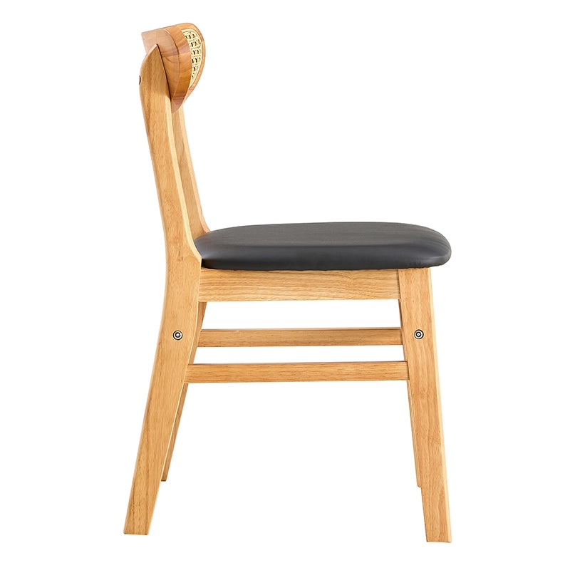 Close-up of the plush cushioning on the upholstered chair with a curved backrest.