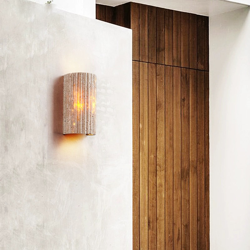 Close-up of the half-cylinder shape of the yellow travertine lamp, highlighting the texture and craftsmanship.