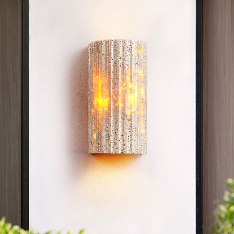 Close-up of the half-cylinder shape of the yellow travertine lamp, highlighting the texture and craftsmanship.