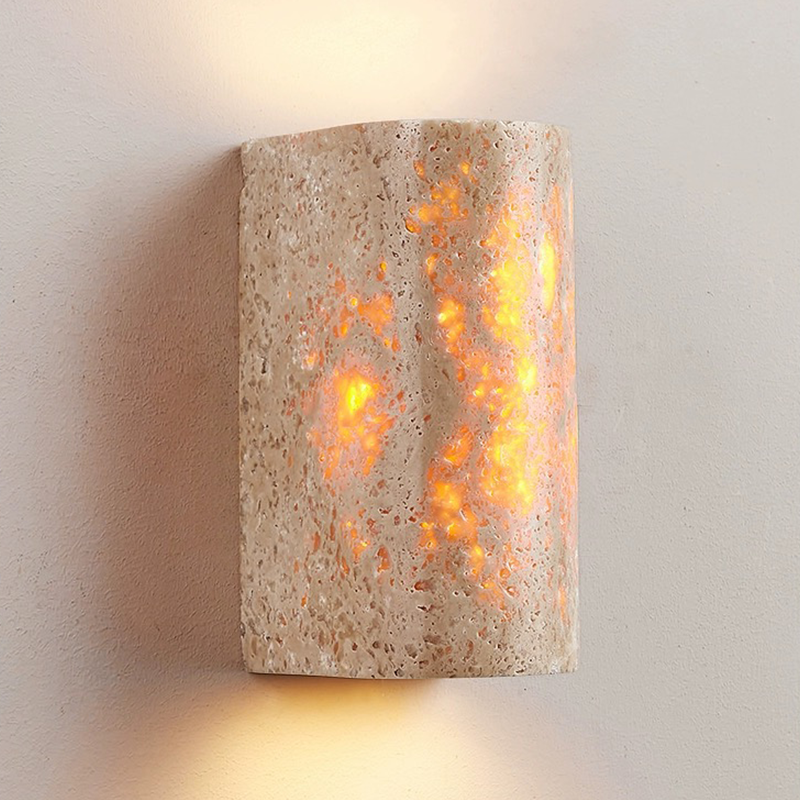Elegant Yellow Travertine Wall Sconce Lamp showcasing its unique patterns and warm glow from an angle.