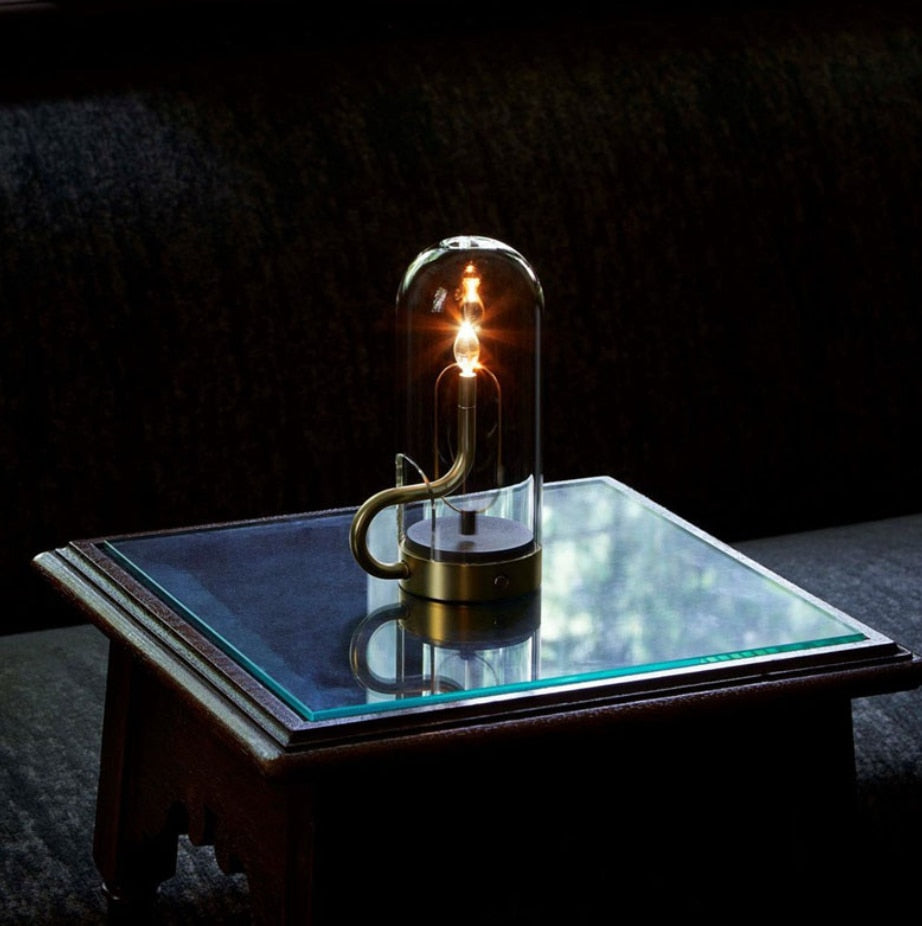 Close-up of the LED table lamp with candle flame effect highlighting its intricate glass design.