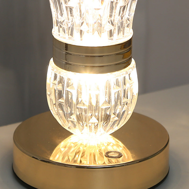 Close-up view of the touch control feature on the decorative lamp.