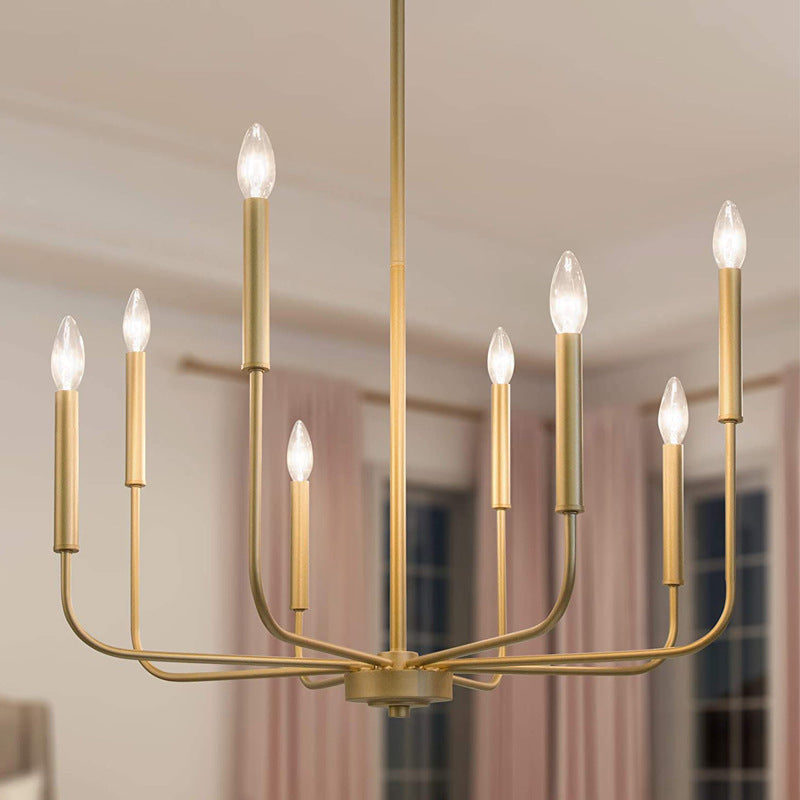 Angle view of the Rustic Elegance Brass Candle Pendant Light installed in a modern rustic living room.
